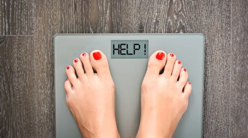 lose-weight-concept-with-person-on-a-scale-measuring-kilograms-2.jpg
